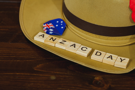 Anzac army slouch hat with Australian Flag on vintage wood backgroundの写真素材