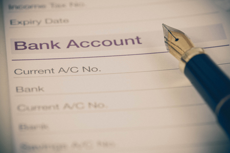 bank account in book note with fountain pen in colorの写真素材