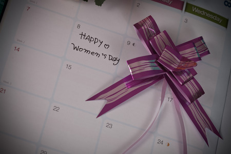 Happy women's day note on calendar book.の写真素材