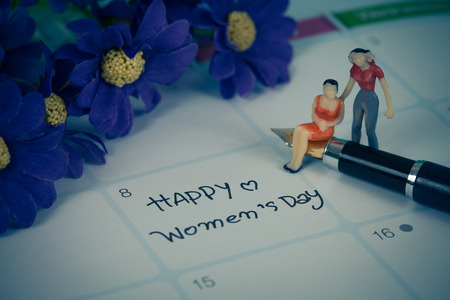 Happy women's day note on calendar book.の写真素材