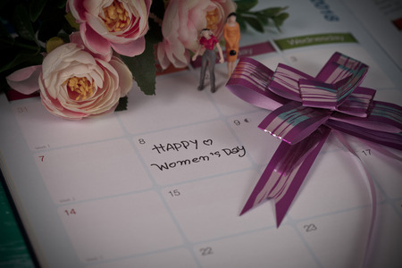 Happy women's day note on calendar book.の写真素材