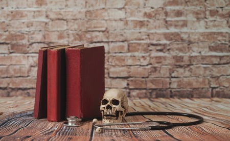 skull with old text book ,concept with medical education .の写真素材