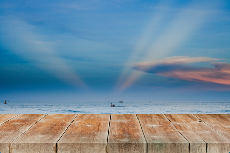 wood walk or terrace over sea with sun ray background.の写真素材