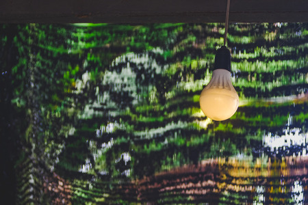 Old led light bulb on beam .の写真素材