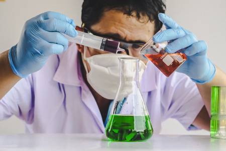 scientist in laboratory to research with test tube , science concept.の写真素材