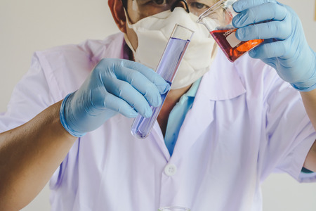 scientist in laboratory to research with test tube , science concept.の写真素材