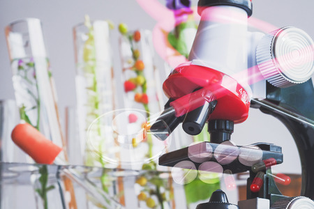 Double exposure microscope and stethoscope or test tube . science concept.の写真素材