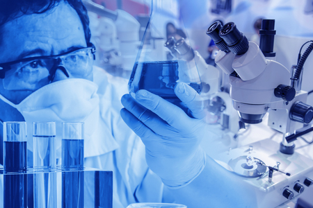 Double exposure Scientist in laboratory to research with test tube , science concept.の写真素材