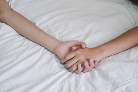 Hands of couple lover  on the bed,Concept about love, sex and lifestyle.