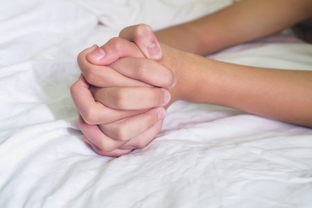 Hands of couple lover  on the bed,Concept about love, sex and lifestyle.の写真素材