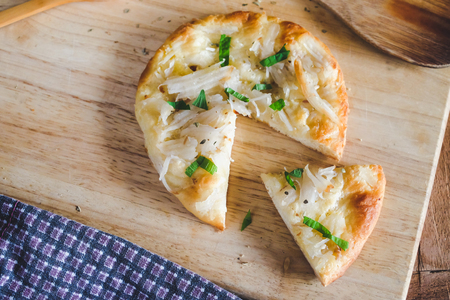 home made pizza and topping with coconut .