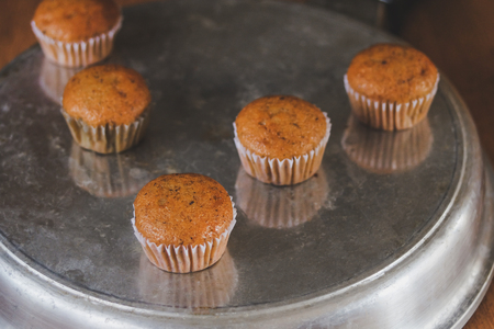 Bakery fresh banana cup cake hot from oven , home made food.の写真素材