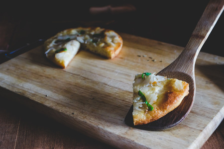 home made pizza and topping with coconut .