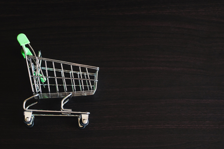 shopping trolley on dark background and some copy space.の写真素材