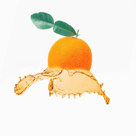 Fresh orange fruit juice splash on white background isolate.の写真素材