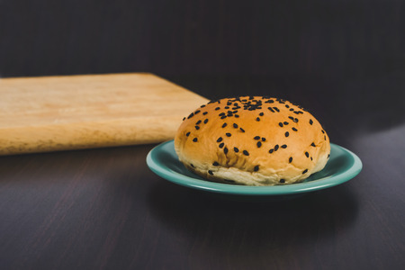 Bread with black sesame seeds in dish ware on background.の写真素材