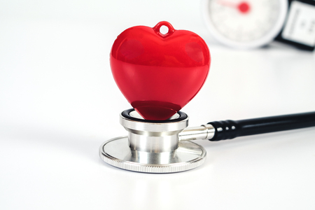 Stethoscope with red heart on white table .Medical accessories with copy space.の写真素材