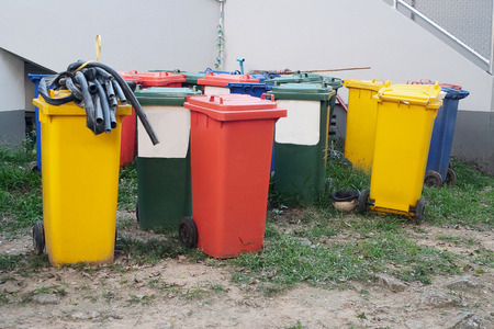 Colorful of trash can beside the walk way.の写真素材