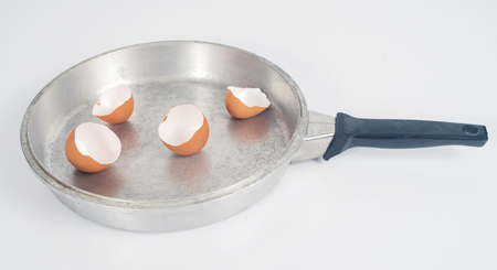 Eggshell with hot pan on background.の写真素材