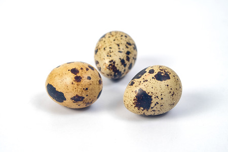 Fresh Quail eggs on background.Food and health concept.の写真素材