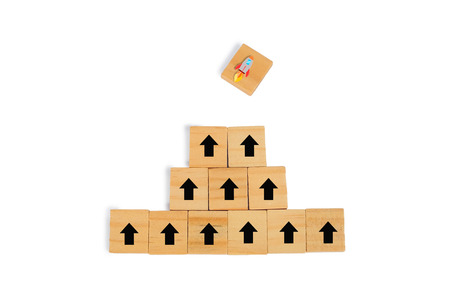 Wooden block with black arrow facing the direction to winner cup, Unique,work heard.の写真素材