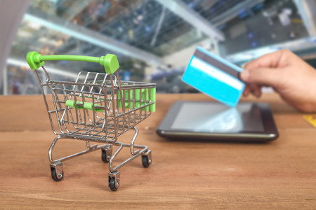 Credit card or debit card on trolley ,shopping concept.の写真素材
