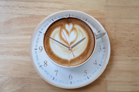 Latte Coffee time for fresher on the wooden table.