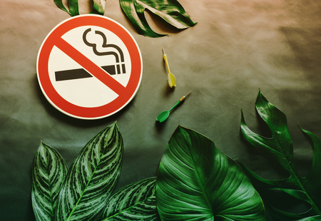 No smoking sign with dart arrow on wall background.health concept.の写真素材