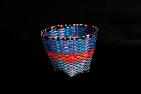 Basket made from upcycled packaging strap materials.の写真素材