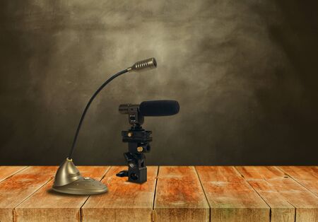 Condenser microphone on woodwalk with background.の写真素材