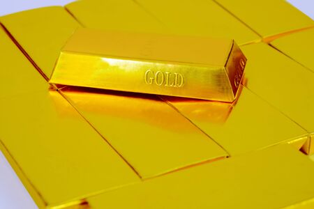 Heap of gold bars isolated on a white background Banking concept.の写真素材