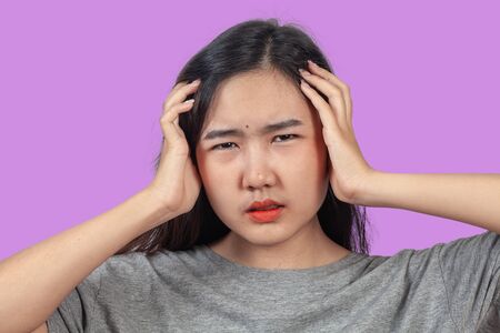 woman suffers from head ache, health concept.の写真素材