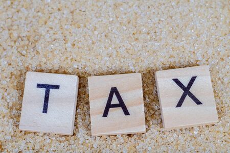 Sugar Tax is a tax or surcharge designed to reduce consumption of drinks with added sugar.の写真素材