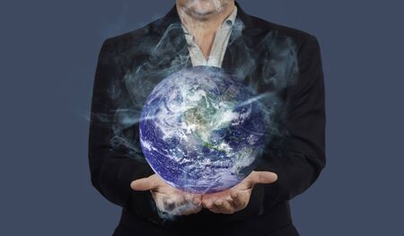 Man hold hot earth in hand ,Global warming concept.