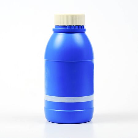 Brake oil in blue bottle on white.の写真素材