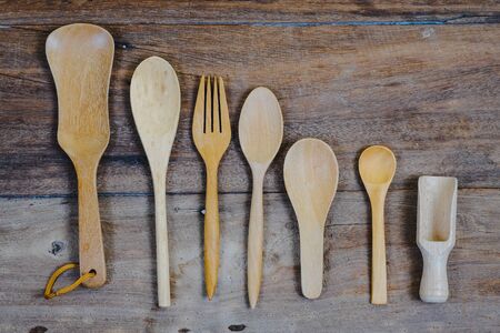 wooden surface and a wooden spoon and fork on wood table.の写真素材