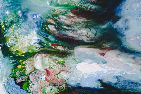 Abstract Oil color paint splatter on ground.