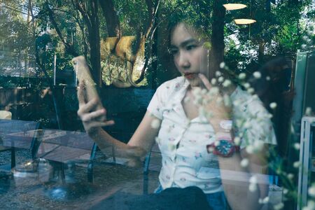 Double Exposure of woman in coffee shop and forest ,Lifestyle conceptual background.