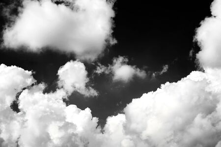 Black sky with white cloud on background, nature concept.