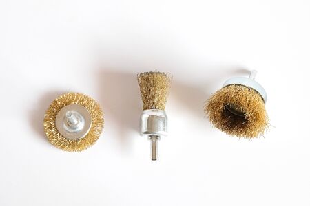 Steel wire brush for drilling machine on white background.