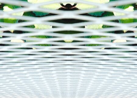 Close up white steel mesh wall.abstract.の写真素材