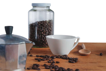 Moka pot coffee maker with fresh coffee bean on table.の写真素材