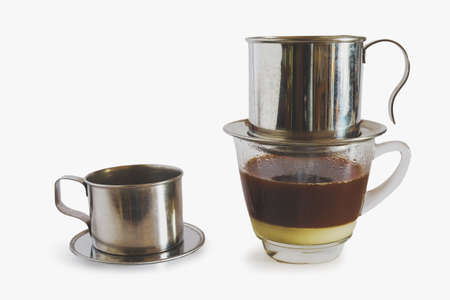 Sweetened condensed milk with hot coffee dripping in Vietnam style.の写真素材