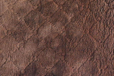 Close up brown woolen fabric on background.