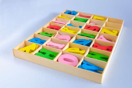 Alphabet Letters  in different colors for decoration of kids in wood box.