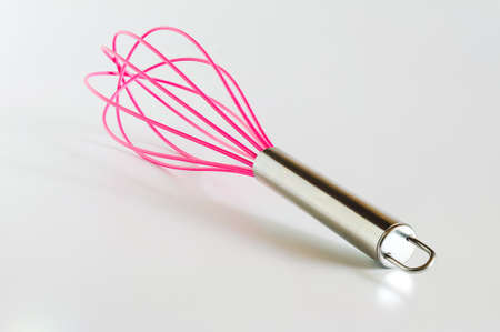 Pink Whisk cooking egg beater mixer whisker new clean with stainless handle.の写真素材