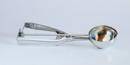 Ice cream scoop over a white background.の写真素材
