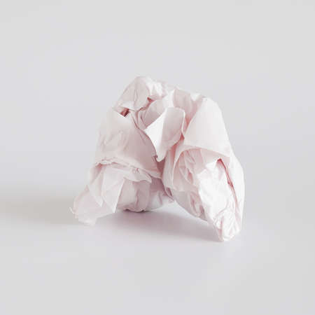 Crumpled paper ball isolated on background.の写真素材