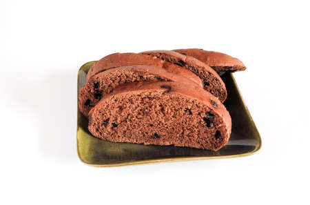 Slices of brown bread with sweet chocolate on white.の写真素材