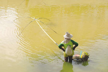 Fishermen using square nets called Yo to catch fish,Fishermen are catching fish with yo.Thailand local catch fish.の写真素材
